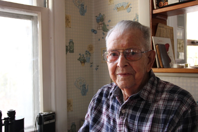 Lucien Lenhart sits by the kitchen window of his home overlooking Betts Pond in Millsboro where he has lived since 1950. BY DENNIS FORNEY
